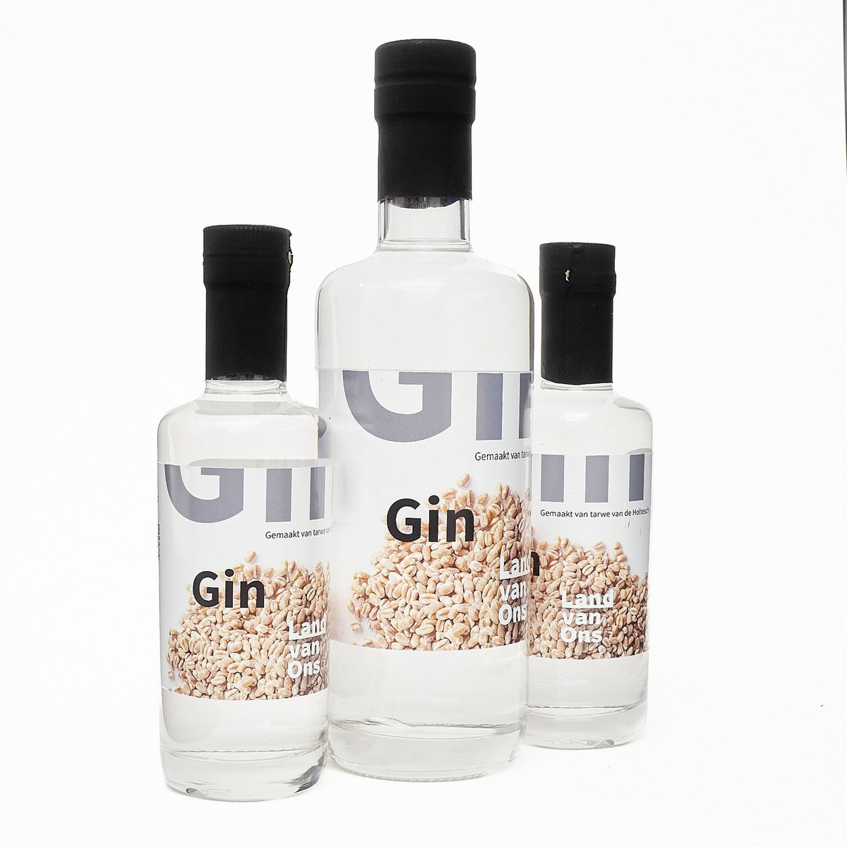 Drie flessen gin van Land van Ons in twee maten