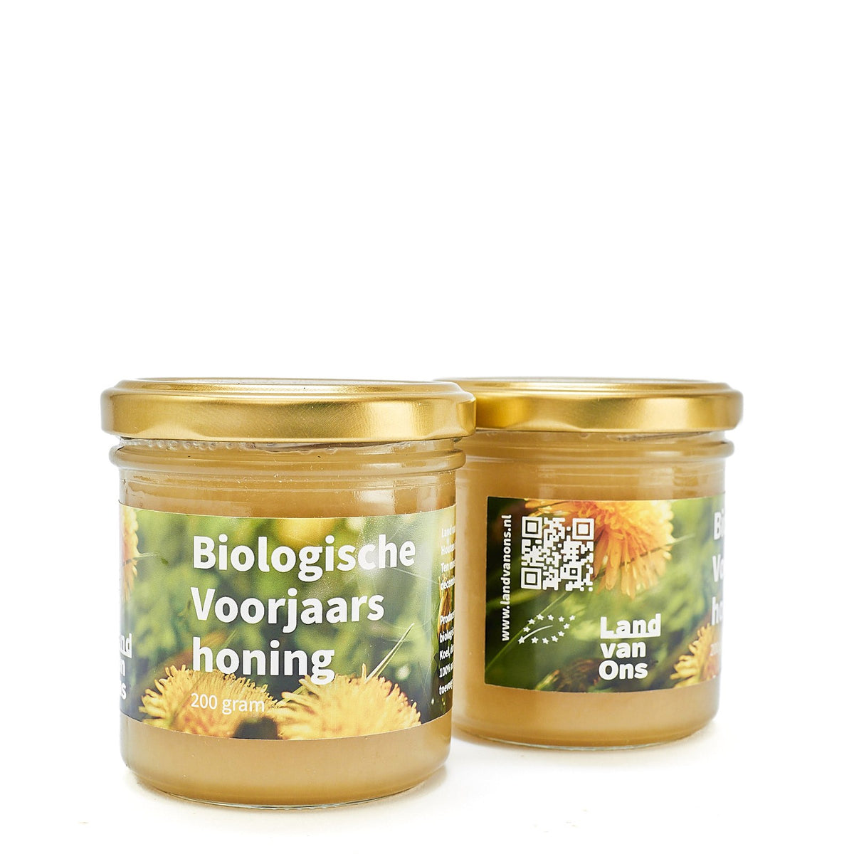 Twee potten biologische voorjaarshoning van Land van Ons met paardebloemen op het etiket