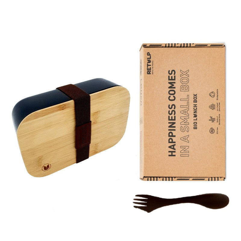 Zwarte lunchbox met bamboe deksel en spork naast de doos van Retulp